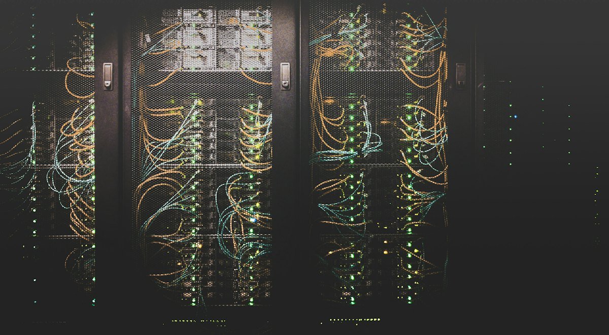 Rows of server racks with cabling in a data center